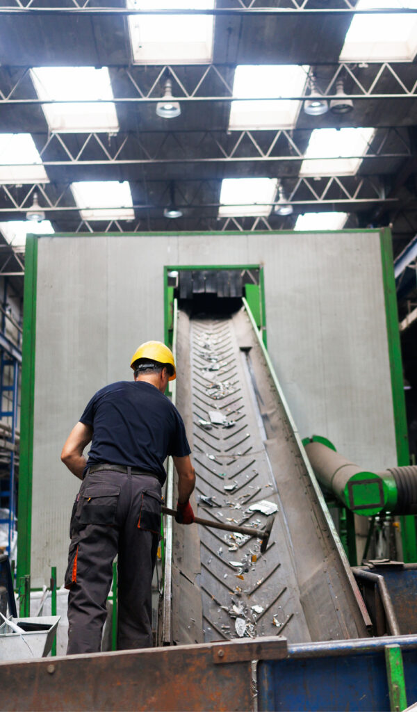 worker in Safety Gear at Waste Sorting Line